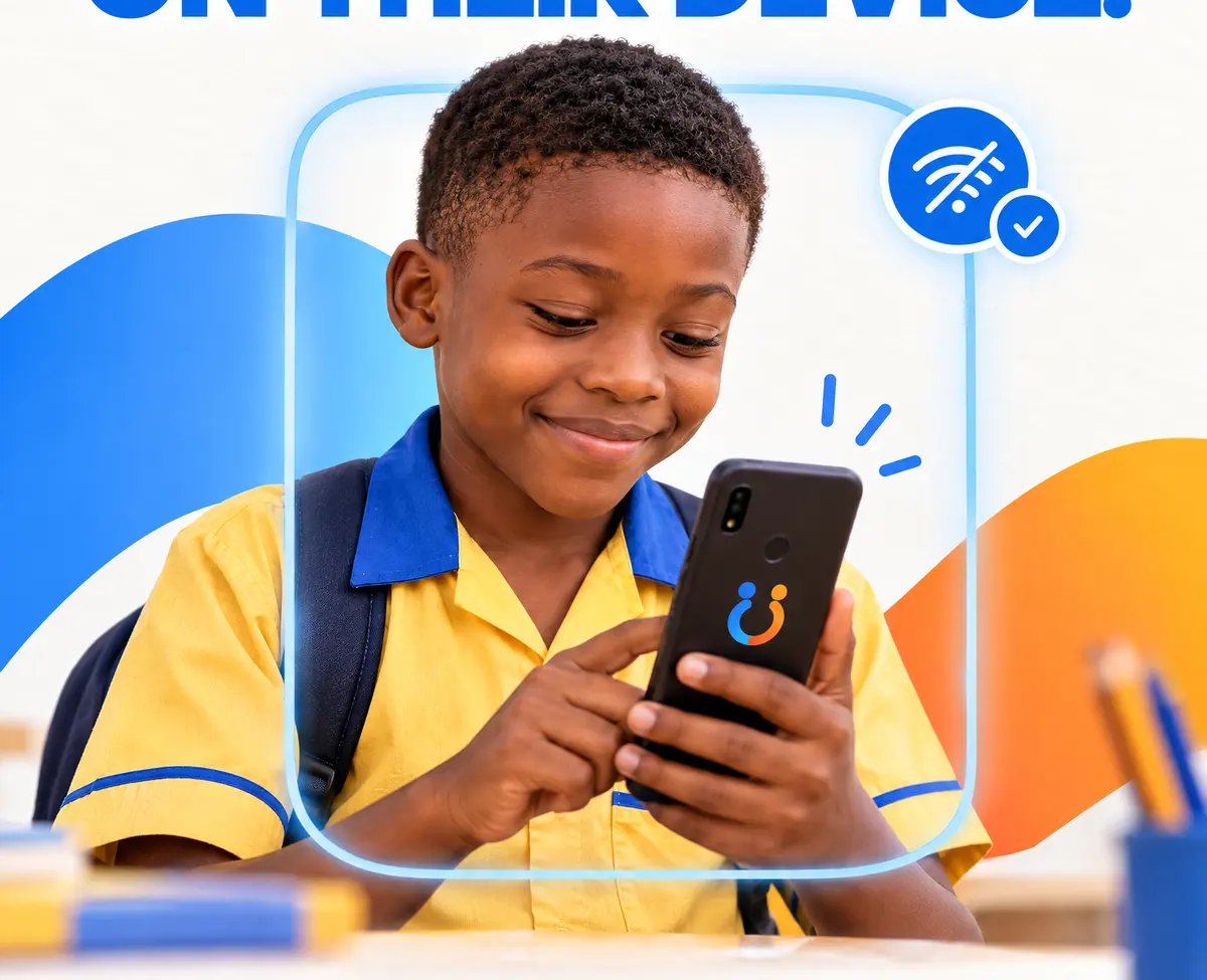 A boy in a school uniform smiles down at a phone showing that he is offline.